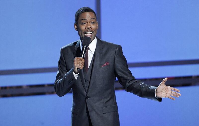 Host Chris Rock speaks on stage at the BET Awards. Chris Pizzello / Invision / AP