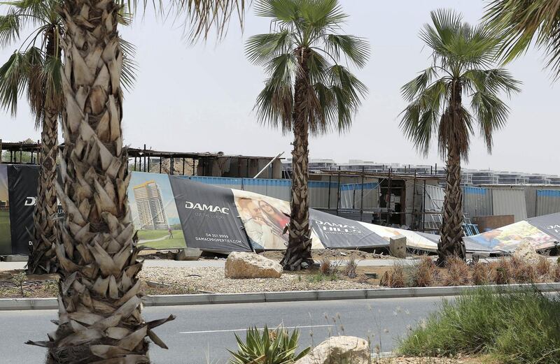 DUBAI, UNITED ARAB EMIRATES , May 25– 2020 :- Barriers around Damac Hills damaged because of last night storm in Dubai.  (Pawan Singh / The National) For News/Online. Story by Nick Webster