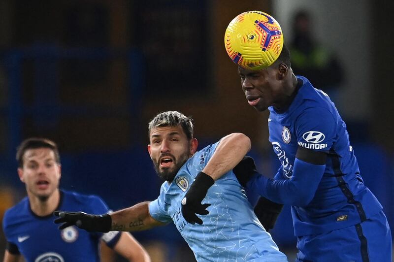 Manchester City's Argentinian striker Sergio Aguero (C) vies with Chelsea's French defender Kurt Zouma (R) during the English Premier League football match between Chelsea and Manchester City at Stamford Bridge in London on January 3, 2021. (Photo by Andy Rain / POOL / AFP) / RESTRICTED TO EDITORIAL USE. No use with unauthorized audio, video, data, fixture lists, club/league logos or 'live' services. Online in-match use limited to 120 images. An additional 40 images may be used in extra time. No video emulation. Social media in-match use limited to 120 images. An additional 40 images may be used in extra time. No use in betting publications, games or single club/league/player publications. / 