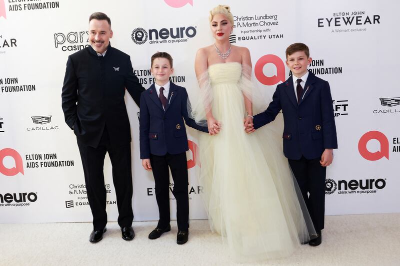 From left, David Furnish, Zachary Jackson Levon Furnish-John, Lady Gaga and Elijah Joseph Daniel Furnish-John attend the Elton John Aids Foundation Academy Awards viewing party. Reuters