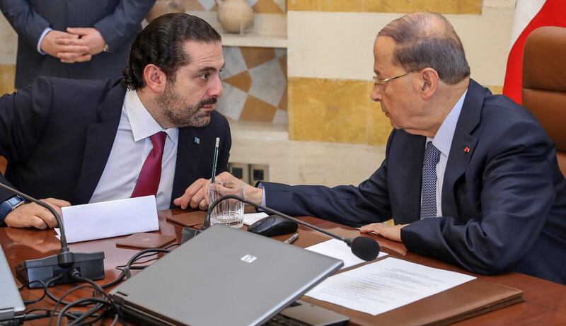 epa06368618 A handout photo made available by the Lebanese official agency Dalati and Nohra shows Lebanese President Michel Aoun (R) and Prime Minister Saad Hariri attending the cabinet meeting at the presidential palace of Baabda, east of Beirut, Lebanon 05 December 2017. Hariri on 05 December officially withdrew his resignation at an extraordinary government meeting in which all the forces of Lebanese politics pledged their commitment to tackling regional conflicts.  EPA/DALATI NOHRA HANDOUT  HANDOUT EDITORIAL USE ONLY/NO SALES