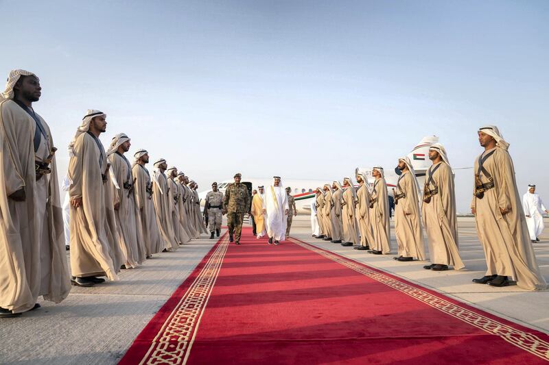 ABU DHABI, UNITED ARAB EMIRATES - May 26, 2019: HH Sheikh Mohamed bin Zayed Al Nahyan, Crown Prince of Abu Dhabi and Deputy Supreme Commander of the UAE Armed Forces (centre R) receives Lieutenant General Abdel Fattah Al Burhan Abdelrahman, Head of transitional military council of Sudan (centre L), at the Presidential Airport.
( Mohamed Al Hammadi / Ministry of Presidential Affairs )
---