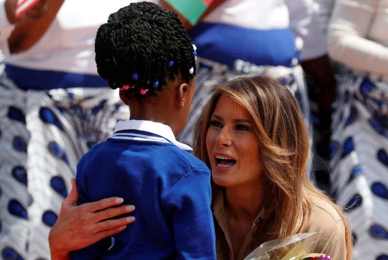 Melania Trump greets a girl giving her flowers at the airport in Lilongwe, Malawi. Carlo Allegri / Reuters