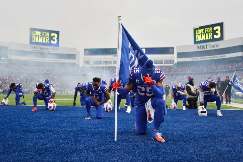 Buffalo Bills running back Taiwan Jones (25) prays for Damar Hamlin before an NFL game against New England Patriots at Orchard Park, New York. Hamlin is in hospital after suffering a cardiac arrest in the Bills' previous match. AP