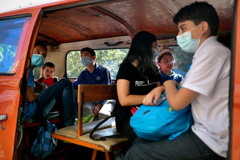 Pupils in a school bus at the end of their school day in Beirut. AP Photo