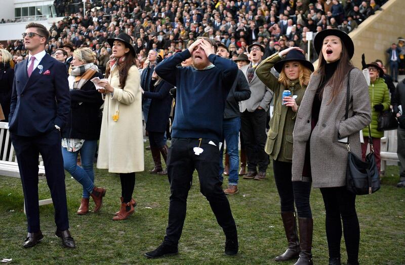 PA via Reuters
Racegoers react after the Martin Pipe Conditional Jockeys' Handicap Hurdle during day four of the Cheltenham Festival at Cheltenham Racecourse.