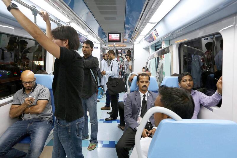 People travelling on the Dubai Metro. Pawan Singh / The National