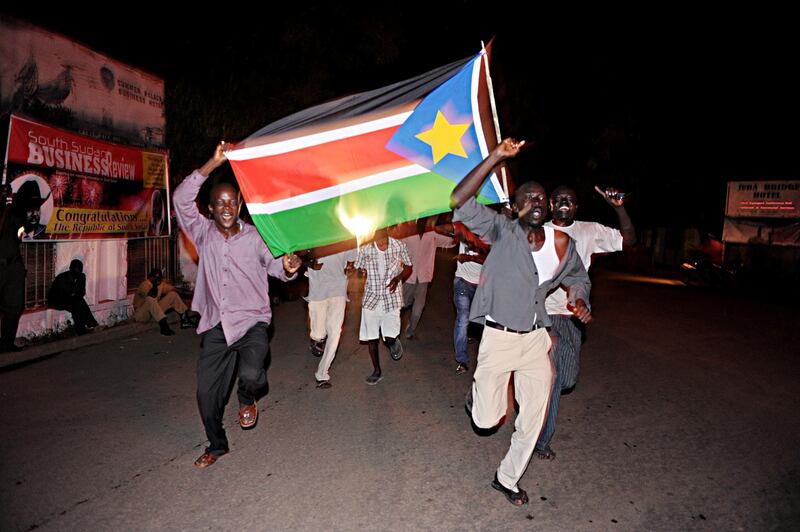 Residents of Juba in South Sudan celebrate in the streets the birth of their new nation on July 9, 2011.  South Sudan separated from Sudan to become the world's newest nation.     AFP PHOTO/Roberto SCHMIDT (Photo by ROBERTO SCHMIDT / AFP)