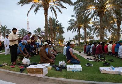 ABU DHABI, UNITED ARAB EMIRATES, 17 May 2018 -Muslims praying before breaking their fast at Sheikh Zayed Grand Mosque, Abu Dhabi. Leslie Pableo for The National