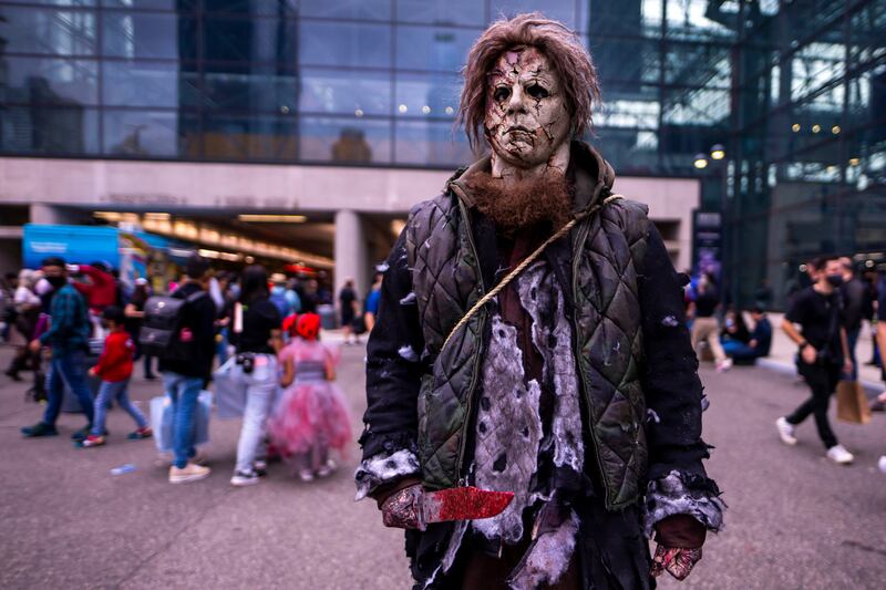 An attendee dressed as Michael Myers poses at the New York Comic Con. Charles Sykes / Invision / AP