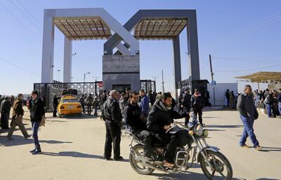 FILE - In this Tuesday, Jan. 20, 2015 file photo, Palestinians wait to cross the border to the Egyptian side at the Rafah crossing, in the southern Gaza Strip.Egyptâ€™s President Abdel Fatah el-Sissi says he has ordered the Rafah crossing point with Gaza strip be opened for the whole Muslim holy month of Ramadan, the longest time since Hamas took over the territory in 2007.  (AP Photo/Adel Hana, File)