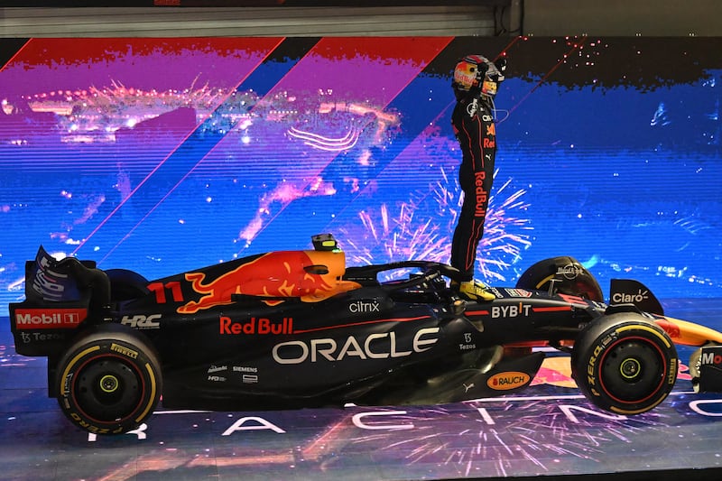 Sergio Perez celebrates after the Singapore Grand Prix at the Marina Bay Street Circuit. AFP