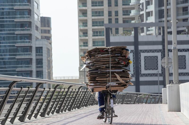 DUBAI, UNITED ARAB EMIRATES. 18 JULY 2020. Dubai Marina Walk now has new signs warning people not to go too fast on their bicycles or e-scooter along the promenade area. (Photo: Antonie Robertson/The National) Journalist: none. Section: National.