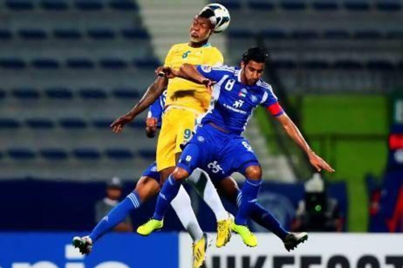 The inexperience of Al Nasr's defenders against a veteran operator such as Djibril Cisse, in yellow, showed as Qatar's Al Gharafa defeated the hosts 4-2 in Dubai last night. Marwan Naamani / AFP