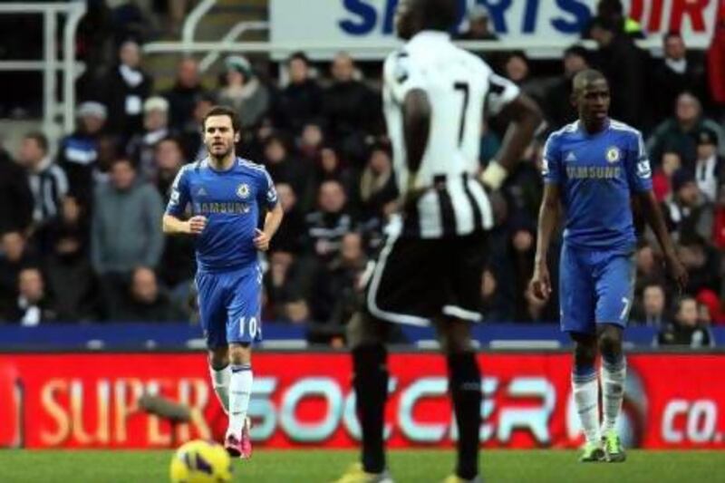 Juan Mata, left, celebrates Chelsea's goal against Newcastle United on Saturday. Scott Heppell / AP Photo