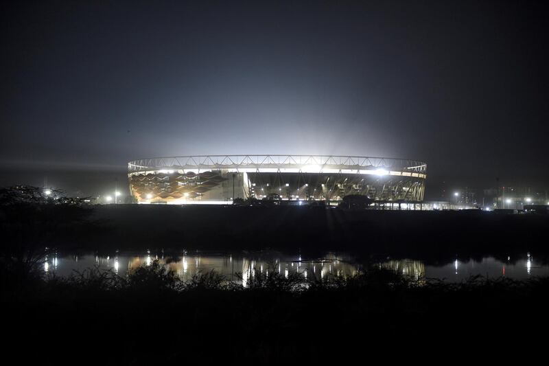 Motera Cricket Stadium, also known as Sardar Patel Stadium, is reflected on the surface of Sabarmati River on the outskirts of Ahmedabad on February 15, 2020, ahead of the visit of US President Donald Trump and his wife Melania in Ahmedabad. (Photo by SAM PANTHAKY / AFP)