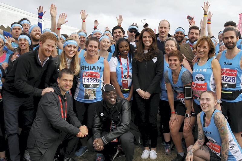 LONDON, ENGLAND - APRIL 23: Prince Harry, Catherine, Duchess of Cambridge and Prince William, Duke of Cambridge pose for a photograph with runners representing the charity 'Heads Together' before officially starting the The Virgin Money London Marathon 2017 on April 23, 2017 in London, England. (Photo by Luke MacGregor - WPA Pool/Getty Images)