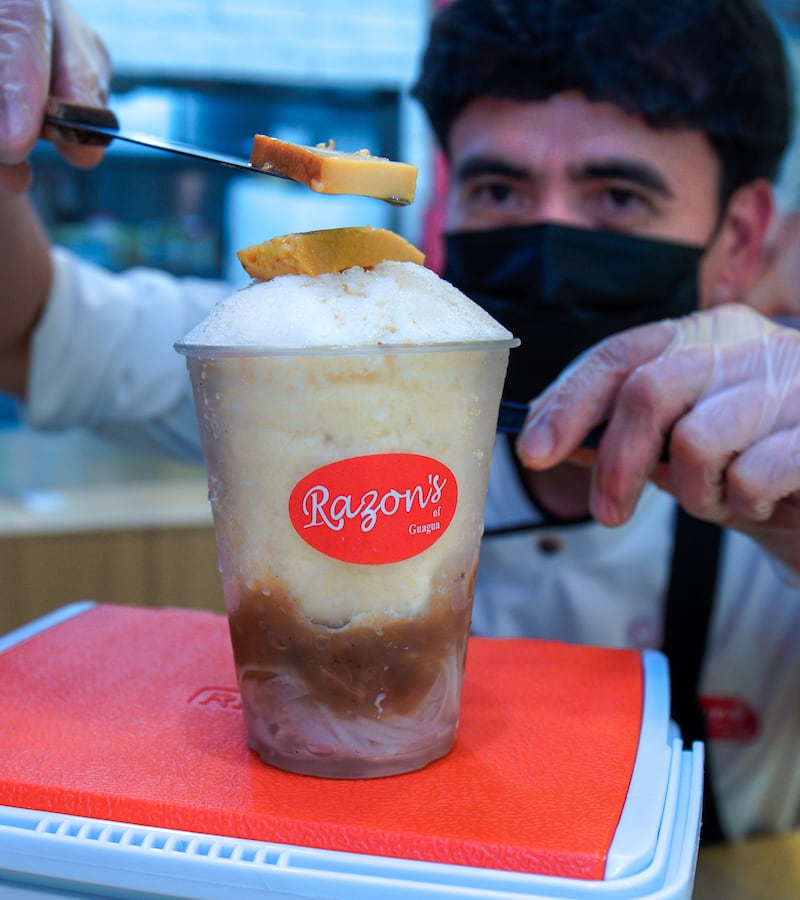 Razon's of Guagua's famous cooler, halo-halo, uses three ingredients – sweetened banana, macapuno (coconut jelly) and leche flan served on fine shaved milk ice.