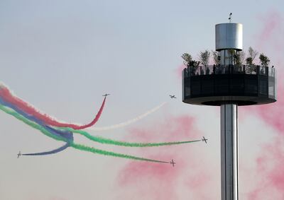 The Al Fursan aerobatics demonstration team perform on the first day of Expo 2020 in Dubai.