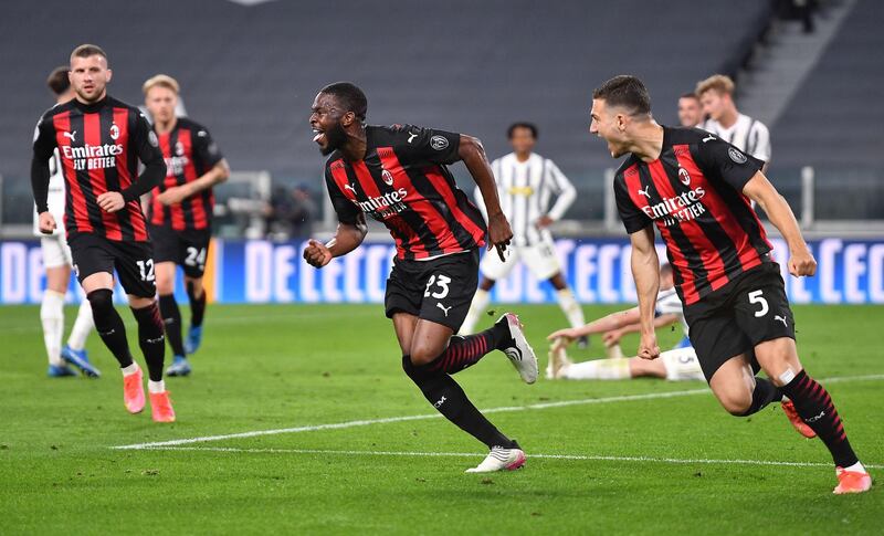 Milan's Fikayo Tomori, centre, celebrates scoring the third goal. EPA