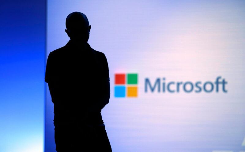 FILE- In this May 7, 2018, file photo Microsoft CEO Satya Nadella looks on during a video as he delivers the keynote address at Build, the company's annual conference for software developers in Seattle. Microsoft announced Monday, May 6, 2019, an ambitious effort to make voting secure, verifiable and reliably auditable with open-source software that top U.S elections vendors say they will explore incorporating into new and existing voting equipment. (AP Photo/Elaine Thompson, File)