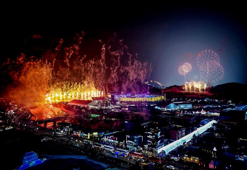 Fireworks go off at the Pyeongchang Stadium during the Winter Olympics opening ceremony. Brendan Smialowski / AFP