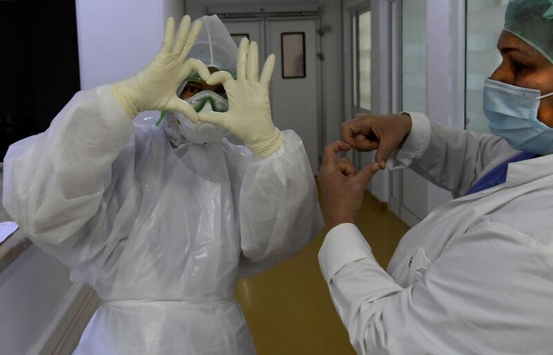 Tunisian medical staff attend coronavirus patients at the intensive care unit of the Ariana Abderrahmen Mami hospital in the city of Ariana near the Tunisian capital Tunis, during the Covid-19 pandemic crisis.  AFP