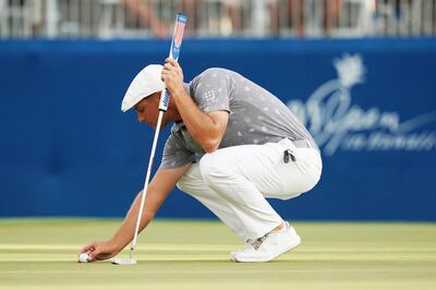 Jan 11, 2019; Honolulu, HI, USA; PGA golfer Bryson DeChambeau lines up a putt on the 18th hole during the second round of the Sony Open in Hawaii golf tournament  at Waialae Country Club. Mandatory Credit: Brian Spurlock-USA TODAY Sports