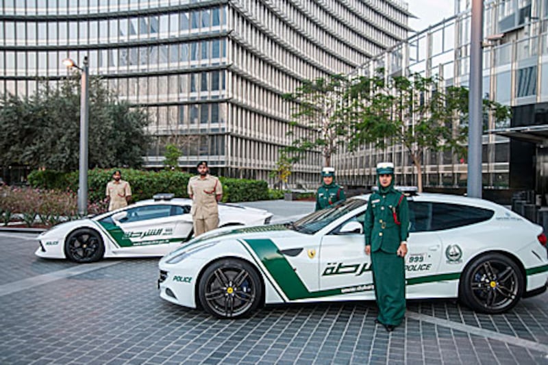 The Lamborghini Aventador, left, and the Ferrari FF were the first supercars to get the Dubai Police decal treatment. Courtesy Dubai Police