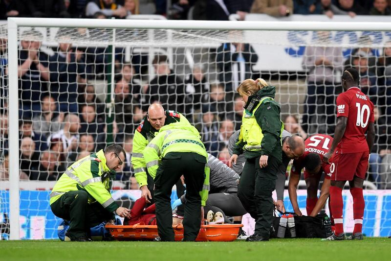 Salah receives medical treatment. Laurence Griffiths / Getty Images