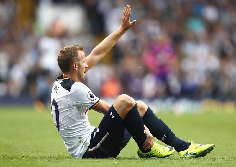 Harry Kane of Tottenham Hotspur gestures to bench as he clutches his leg during the Premier League match against Sunderland. Julian Finney / Getty Images