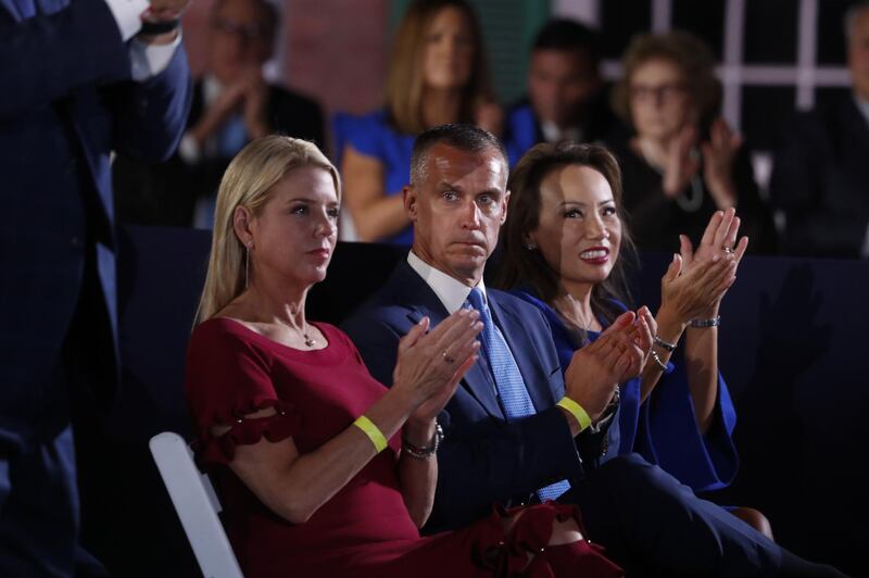 Corey Lewandowski, former campaign manager for U.S. President Donald Trump, center, listens as U.S. Vice President Mike Pence speaks. Bloomberg