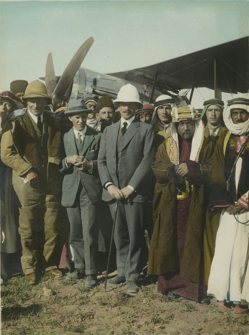 On the Aerodrome at Amman. Col. Laurence [T.E. Lawrence]. Sir Herbert Samuel. Amir Abdullah. April, 1921. [Gertrude Bell (?) at left and Sheik Majid Pasha el Adwan at far right]. Meetings of British, Arab, and Bedouin officials in Amman, Jordan, April. Courtesy Library of Congress, Prints & Photographs Division