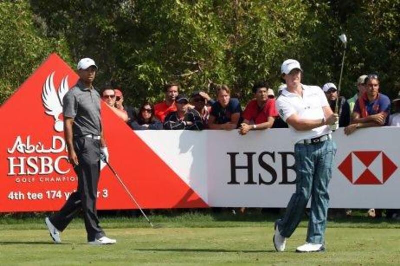 Rory McIlroy, right, met Tiger Woods on the links for their first official tournament together last year at the Abu Dhabi HSBC Championship. The pair will play again in this year's tournament, which starts Thursday.