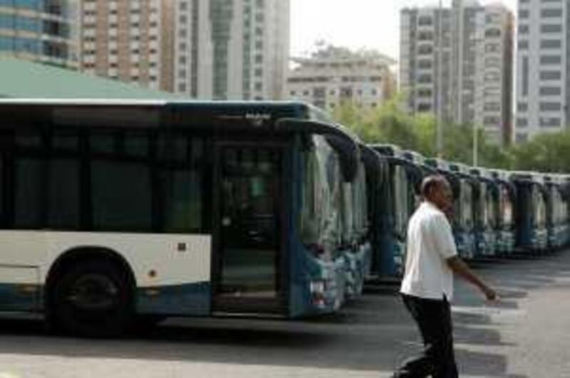 ABU DHABI, UNITED ARAB EMIRATES - August 18, 2009: New public buses parked at the Bus Terminal in Abu Dhabi will be put into use in Abu Dhabi on the first day of Ramadan. (Ryan Carter / The National)
 *** Local Caption ***  RC002-NewBuses.jpg