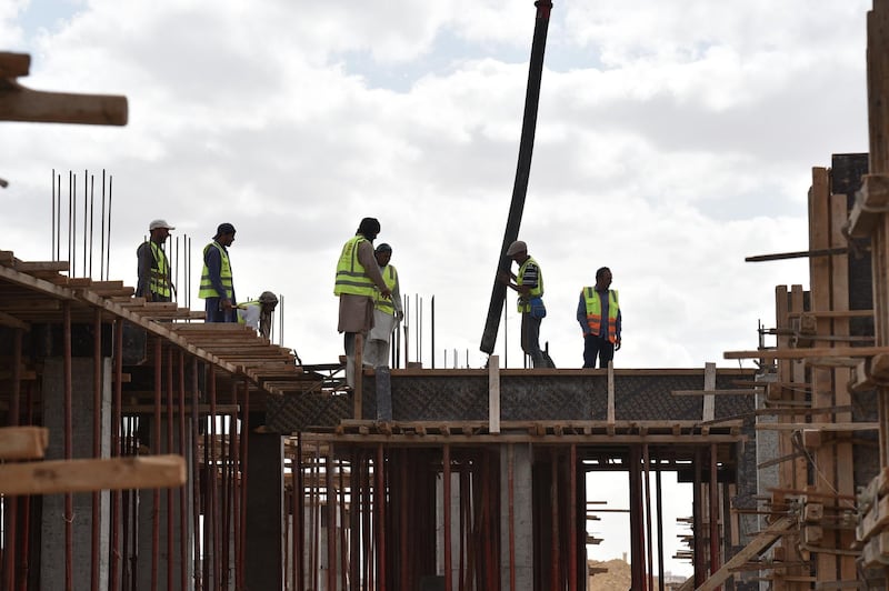 Foreign labourers work on the construction of a house in the Saudi capital Riyadh on April 13, 2019. - Housing is a potential lightning rod for public discontent in a country where affordable dwellings are beyond the reach of many, posing a key challenge for Crown Prince Mohammed bin Salman as he seeks to overhaul the oil-reliant economy. (Photo by FAYEZ NURELDINE / AFP)