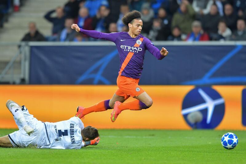 Manchester City's Leroy Sane, right, fails to score past Hoffenheim's Oliver Baumann. AFP