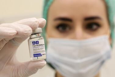 A nurse handles a vial of the Sputnik V vaccine in Moscow on Wednesday. Andrey Rudakov / Bloomberg