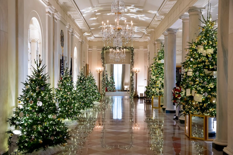 Christmas trees line the Cross Hall during the unveiling of holiday decor at the White House. EPA