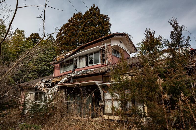 An abandoned house in the 'difficult-to-return' zone, in Namie, Japan. On March 11, Japan will mark the 10th anniversary of the Tohoku earthquake, tsunami and triple nuclear meltdown, in which almost 16,000 people were killed. Getty Images