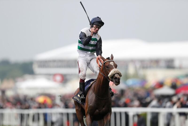 Oisin Murphy on Dashing Willoughby celebrates after winning the Queen's Vase race. Reuters