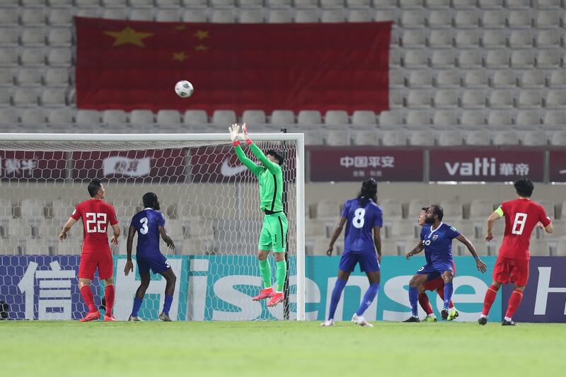 China's goalkeeper Yan Junling reaches up to collect a cross during a Group A Qatar 2022 World Cup qualifier against the Maldives, at Sharjah Stadium, Sharjah. China won 5-0. Getty Images