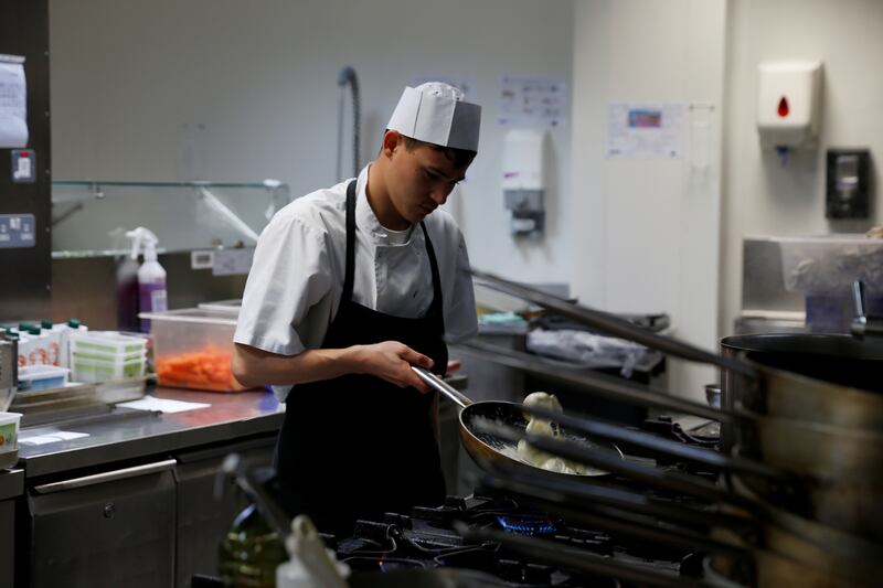 A cook at the Agliolio Restaurant in the Radisson Blu hotel at Golden Bay in Malta. Reuters