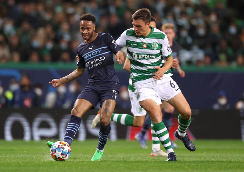 Manchester City's Raheem Sterling under pressure from Sporting's Joao Palhinha. Reuters