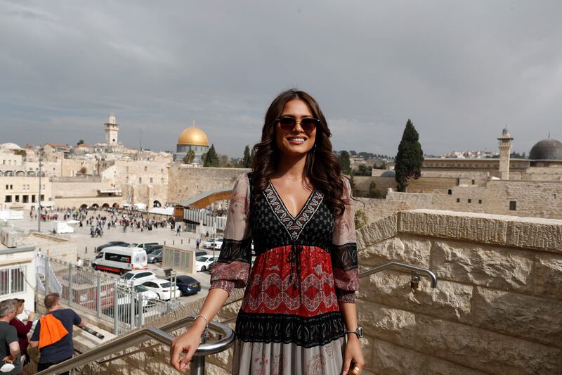 Miss Universe Andrea Meza from Mexico is backdropped by the Western Wall and Al Aqsa Mosque during a tour in Jerusalem's Old City. EPA