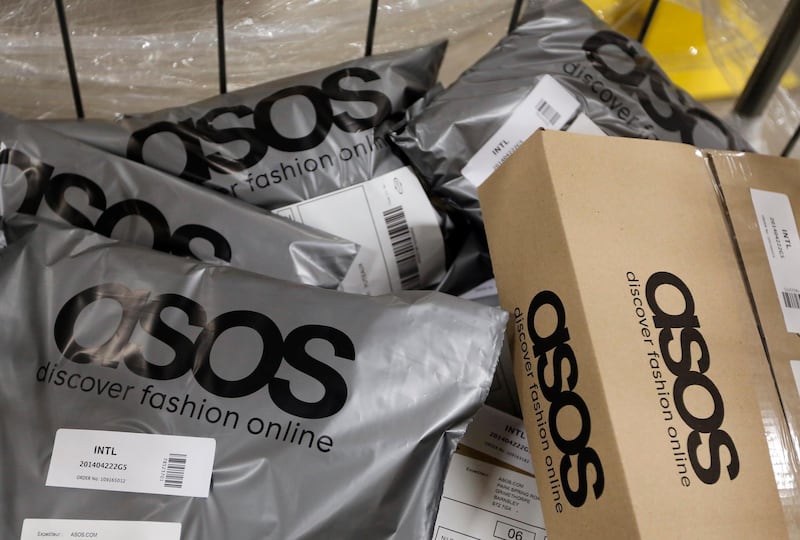 Completed customer orders sit in a trolley ahead of shipping at Asos Plc's distribution warehouse in Barnsley, U.K., on Tuesday, April 22, 2014. Asos, the U.K.'s largest online-only fashion retailer, said it plans to more than triple revenue as increased spending on warehousing and distribution enables it to support an even bigger customer base. Photographer: Chris Ratcliffe/Bloomberg