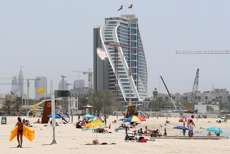 Dubai, United Arab Emirates - Reporter: N/A: News. The public beach next to the Burj Al Arab is busy as beaches in Dubai re open for the second day. Saturday, May 30th, 2020. Dubai. Chris Whiteoak / The National