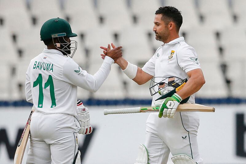 South Africa's Temba Bavuma (L) shakes hands with South Africa's Dean Elgar (2nd L) after South Africa won the second Test cricket match between South Africa and India at The Wanderers Stadium in Johannesburg on January 6, 2022.  (Photo by PHILL MAGAKOE  /  AFP)
