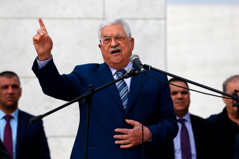 (FILES) In this file photo taken on November 11, 2018, Palestinian President Mahmoud Abbas gives a speech after laying a wreath at the tomb of late Palestinian leader Yasser Arafat inside the Mukataa compound, in the the West Bank city of Ramallah. The decade-long Palestinian split looks set to deepen in the coming months, with officials saying president Mahmud Abbas will take a series of measures against Gaza to squeeze its Islamist rulers Hamas. / AFP / ABBAS MOMANI
