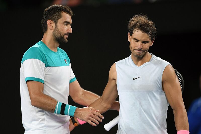 epa06467605 Rafael Nadal (R) of Spain and Marin Cilic (L) of Croatia shake hands after Nadal retired from their quarter final match at the Australian Open Grand Slam tennis tournament in Melbourne, Australia, 23 January 2018.  EPA/LUKAS COCH AUSTRALIA AND NEW ZEALAND OUT